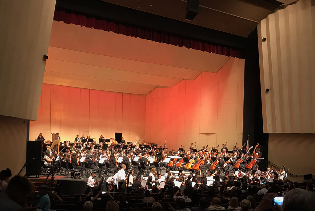 More than 300 young players crowd onto the Saroyan Theatre stage.