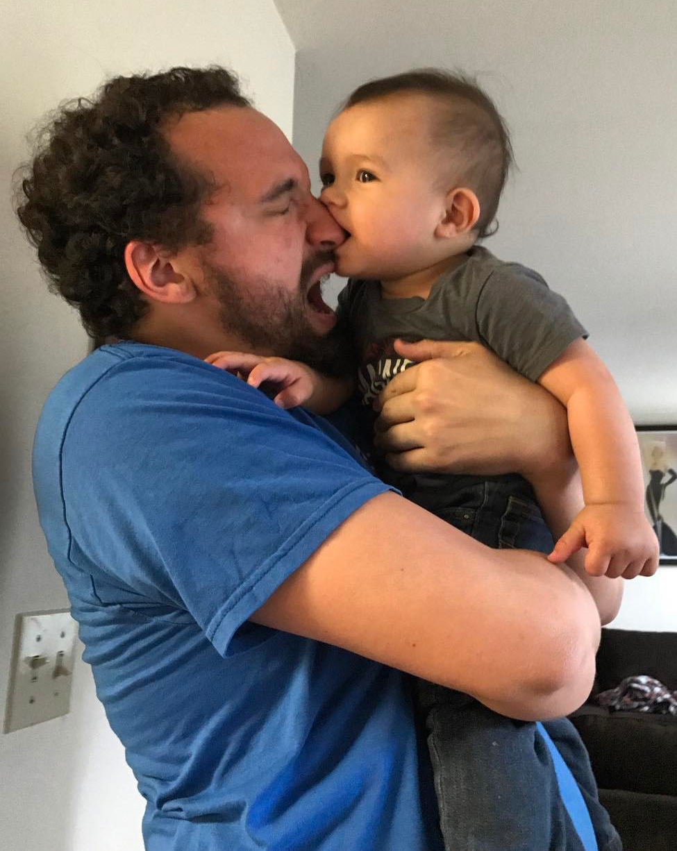 Photo of director Jacob Sherwood holding his son, Asher, in Woodward Shakespeare Festival production of 'Twelfth Night.'