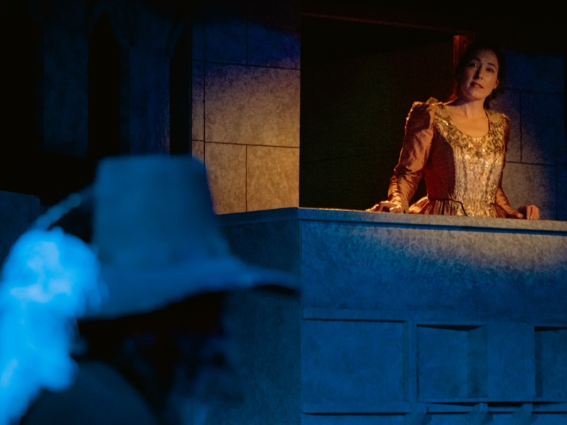 Jessica Rose Knotts as Roxane listening to poetry from the balcony in Cyrano de Bergerac at Good Company Players.