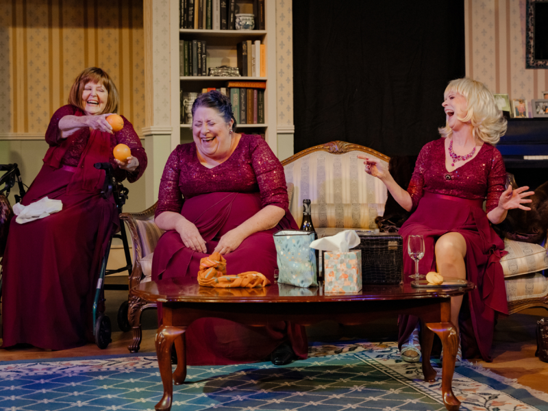 three actresses and friends in The Cemetery Club laugh